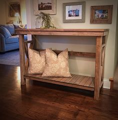 a wooden table with two pillows on it