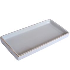 a white and gold serving tray on a white background