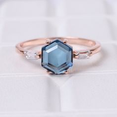 Hexagon London Blue Topaz Ring, Art Deco Engagement Ring, 18k Rose Gold Bridesmaid Gift, November Birthstone Delicate Ring, Women's Jewelry Maine Stone - Topaz Stone Creation - Lab Created  Stone Shape - Hexagon Stone Color - Blue Stone Size - 7 mm Birthstone - November Second Stone - CZ Diamond Stone Shape - Baguette  Stone Color - Colorless Features: * Handmade * Ready To Ship * Brand New * All Ring Sizes Available * Suitable For Every Day * 14k Solid Gold / 18k Solid Gold / Gold Filled Over S Sapphire Faceted Jewelry For Wedding, Wedding Topaz Octagon Ring With Diamond Cut, Topaz Octagon Ring For Anniversary, Octagon Diamond Cut Topaz Ring For Wedding, Octagon Diamond Cut Topaz Wedding Ring, Blue Faceted Sapphire Ring For Wedding, Octagon Topaz Jewelry For Wedding, Diamond Octagon Topaz Ring For Wedding, Octagon Topaz Ring As A Gift