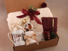 a christmas gift box filled with coffee, tea and other holiday gifts for someone special