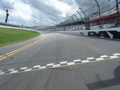 a man riding a motorcycle on top of a race track