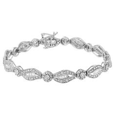 Add a little sparkle to your outfit with this lovely sterling silver link bracelet that features 1 ct TDW of diamonds. A round cut diamond sits in the middle of a beaded silver halo and serves as on of the links that alternates throughout the bracelet with baguette studded leaf shaped links. The leaf shape link features a row of shimmering baguette cut diamonds that is framed between two silver beaded ribbons accented with round diamond that add extra sparkle. 'Video Available Upon Request.' Pro Classic Silver Oval Diamond Bracelet, Silver Oval Diamond Bracelet With Brilliant Cut, Sterling Silver Diamond Bracelet With Pave Setting For Anniversary, Classic Silver Sparkling Diamond Bracelet, Silver Sparkling Round Diamond Bracelet, Round Diamond Bracelet Fine Jewelry, Sparkling Round Diamond Bracelet Fine Jewelry, Sparkling Diamond Fine Jewelry Bracelet, Fine Jewelry Silver Tennis Bracelet With Diamond Accents