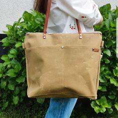 Waxed Canvas Tote and Crossbody Bag. The space of this tote is big enough for all of your daily things. Perfect for holding your personal items, such as your laptop, wallet, phone, magazine, documents, card, umbrella and so on. It use the zipper closure on the top of the bag which makes your things safe. You can use the bag as a casual tote or crossbody bag. Easy to match with daily clothes and ideally designed for everyday use. It is also a wonderful gift for women and girls. It has a spacious Khaki Canvas Bag For On-the-go, Everyday Khaki Canvas Bag, Everyday Large Capacity Waxed Canvas Bag, Large Capacity Duck Canvas Bag For Everyday Use, Casual Duck Canvas Shoulder Bag With Large Capacity, Khaki Canvas Tote Bag With Canvas Lining, Casual Large Capacity Duck Canvas Shoulder Bag, Everyday Duck Canvas Shoulder Bag, Khaki Canvas Tote Bag