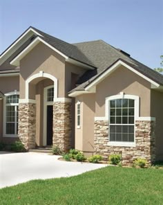 a large house with stone and brick accents