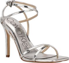 Chic Silver Sandals For Spring, Spring Cocktail Trendy Sandals, Calvin Klein Evening Heels For Spring, Spring Silver Strappy Sandals, Silver Strappy Sandals For Spring, Trendy Calvin Klein Sandals For Spring, Elegant Calvin Klein Sandals For Spring, Calvin Klein Party Sandals For Spring, Spring Cocktail Sandals