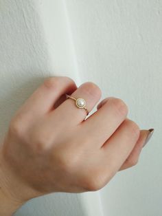 14K 9K Gold Solitaire Pearl Ring, Minimalist pearl ring, Dainty pearl ring, Stacking ring, Promise ring, Engagement ring, Gift for her, 14K Rose gold ring, Gift for her, Anniversary ring, FREE EXPRESS SHIPPING Beautiful and delicate white pearl ring made in 14K or 9K solid gold. The pearl is natural and not colored. Whisper...Always on trend! ;) -------------------------------------------------- D E T A I L S 14K or 9K Solid Gold Natural White Pearl 5mm Band width 1.4mm ------------------------- Minimalist Pearl Drop Ring For Wedding, Minimalist Wedding Pearl Ring With Pearl Drop, Minimalist Rose Gold Pearl Ring, Minimalist Pearl Open Ring For Promise, Minimalist Open Pearl Ring For Promises, Minimalist Pearl Drop Ring For Anniversary, Gold Everyday Pearl Ring With Pearl Drop, Minimalist Pearl Drop Ring For Gift, Minimalist Pearl Rings With Pearl Charm