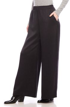 A versatile solid hue brings chic appeal to these flowy wide-leg pants crafted with a comfortable elastic waist. 29" inseam; 29" leg opening; 13" front rise; 16" back rise (size Medium) Pull-on style Front slant pockets 55% polyester, 45% recycled polyester Dry clean Made in the USA of imported fabric Versatile Wide Leg Pants For Spring Evening, Versatile Wide Leg Pants For Evening In Spring, Versatile Evening Wide Leg Pants For Spring, Casual Evening Pants, Casual Straight Pants For Evening, Sleek Wide Leg Pants With Pockets, Sleek Wide Leg Pants For Spring Evenings, Elegant Black Wide Leg Pants With Elastic Waistband, Sleek Wide Leg Pants For Evening In Spring