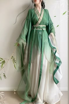 3 Pieces Hanfu Set: Outer layer + Inner Layer + Skirt Embrace timeless beauty with this exquisite green hanfu, a perfect blend of traditional elegance and modern grace. The flowing layers of sheer, lightweight fabric are artfully designed to drape beautifully, creating a sense of ethereal charm. Ideal for cultural events, traditional ceremonies, or as a unique addition to your wardrobe, this hanfu offers a graceful nod to history while ensuring you stand out in any setting. Green Hanfu, Traditional Chinese Clothing Hanfu, Gaun Abad Pertengahan, Traditional Asian Dress, Fairy Cosplay, Hanfu Dress, Chinese Clothing, Chinese Dress, Traditional Clothing