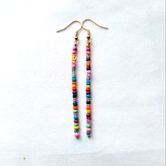 Colorful Boho Handmade Glass Seed Beaded Dangle Stick Earrings Finished With Gold Tone Hook Ear Wires Gypsy Hippie Retro Mod Nickel Free Gold Tone Hook Ear Wires With Clear Backs To Help Keep In Place Dainty Tiny Glass Seed Beads In Multi Colors, Randomly Chosen By Me To Create You A Beautiful Unique Pair Of Earrings Using The Same Bead Colors Yet Randomly Selected Approximately 3.25 Inch Length Handmade Beautiful Earrings To Wear Daily Or Give As A Gift For Christmas, Anniversary, Birthday, Val Glass Seed Bead Earrings, Adjustable Beaded Chain Earrings For Beach, Minimalist Beaded Earrings, Beaded Chain Dangle Earrings For Beach, Dangle Beaded Earrings For Beach, Everyday Multicolor Dangling Beads Earrings, Everyday Multicolor Earrings With Tiny Beads, Adjustable Beaded Chain Earrings For Summer, Adjustable Beaded Earrings With Dangling Beads For Everyday