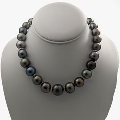 This necklace is absolutely stunning. Words can barely do it justice, but let me attempt to capture its essence. A magnificent treasure ready to be cherished for generations, this Tahitian pearl necklace represents the pinnacle of luxury and elegance. Expertly chosen pearls, arranged and artfully strung together to create a breathtaking masterpiece. Meticulously crafted, the necklace combines the rare glamour of Tahitian pearls with the rhodium-plated 14K yellow gold filigree ball clasp and tire Fine Jewelry Tahitian Pearl Necklace For Anniversary, Tahitian Pearl Fine Jewelry Necklace For Anniversary, Luxury Tahitian Pearl Round Bead Necklace, Tahitian Pearl Necklace For Anniversary, Formal Tahitian Pearl Pendant Jewelry, Elegant Tahitian Pearl Necklace For Formal Occasions, Elegant Tahitian Pearl Necklace With High Luster, Formal Single Strand Tahitian Pearl Necklace, Elegant Tahitian Pearl Jewelry With Round Beads