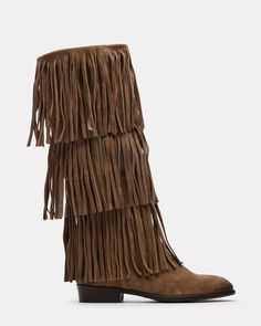 Upgrade your wardrobe with the SPUR fringe boot. These boots feature a fringe detailing that adds a touch of effortless style. Perfect for any occasion, these boots will elevate your look while providing comfort and durability. 1 inch heel height 14.5 inch shaft circumference 15 inch shaft height Suede upper material Synthetic lining Leather sock Synthetic sole Fit tip: If you are in between sizes, size up a half-size Imported Western Suede Fringe Boots, Western Style Suede Boots With Fringe, Casual Fringe Boots For Fall, Brown Fringe Winter Boots, Leather Fringe Boots For Fall, Winter Fringe Ankle Boots, Light Brown Cowgirl Boots, Fringe Boots Outfit, Mexico Outfit Ideas