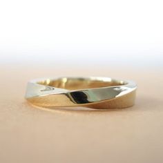 a close up of a gold ring on a table