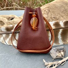 "Vegan Eco Leather Medicine Bag, Shaman Bag or Amulet Pouch to wear around your neck-or hang in your Car! A place for things that have Spiritual Meaning for you-your Sage,Crystals,or that pretty rock your 3 year old gave you.... 3 3/4\"deep 2 3/4\"wide Choice of 2 colors:- - -Black /Double Terminated Labradorite Crystal Point -Russet Brown/Red Agate and Baltic Amber Stones Please note these are natural Gemstones- each one is completely different...like snowflakes! BUY ANY 4 MEDICINE BAGS(VEGAN L Brown Portable Pouch For Gift, Handmade Bags For Daily Use, Small Brown Bag For Gift, Small Brown Gift Bag, Brown Portable Bag As Gift, Brown Travel Bag For Gift, Brown Coin Purse For Gifts, Brown Portable Coin Purse For Gift, Portable Brown Coin Purse For Gift