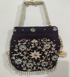 This beautiful Potli or batawa bag are eye catchy and made of premium material. Key Features: Potli Bag Dimension -- 10*8 Inches Embroidery art work This potli is good match with both Indian and western outfits and are superb for wedding and festive parties This would be best complement to your designer saree, lenhga or any other kind of dress This is the combination of traditional and modern embroidery work This is enough to keep your accessories and all needed essentials and it can be a best g Festive Embroidered Rectangular Shoulder Bag, Embroidered Rectangular Festive Pouch, Festive Gold Embroidery Rectangular Shoulder Bag, Festive Rectangular Embroidered Pouch, Traditional Multicolor Handheld Evening Bag, Elegant Multicolor Embroidered Shoulder Bag, Embroidered Rectangular Shoulder Bag For Celebration, Traditional Multicolor Shoulder Bag For Formal Occasions, Rectangular Embroidered Shoulder Bag For Celebration