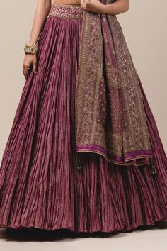 Purple crushed striped zari chanderi lehenga paired with blouse enhanced with zardozi, kasab and kundans. Comes with detachable brocade drape-dupatta embroidered in kasab and sequins.
Component: 3
Embroidered
Neckline: V Neck
Sleeve Length: Half
Fabric: Chanderi, Brocade
Color: Purple
Tassel tie-up back
Bead tassels - Aza Fashions Wedding Lehenga With Dori Work In Slub Silk, Reception Slub Silk Lehenga With Cutdana Details, Reception Slub Silk Lehenga With Cutdana, Slub Silk Cutdana Lehenga For Reception, Reception Slub Silk Lehenga With Zari Work, Slub Silk Lehenga With Traditional Drape For Reception, Traditional Drape Slub Silk Lehenga For Reception, Reception Slub Silk Lehenga With Pallu, Traditional Slub Silk Lehenga For Reception