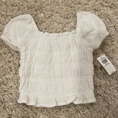 Old Navy White Elastic Toddler Top With Puff Sleeve Size 18m Cute Solid Color Tops With Puff Sleeves, Cute Solid Puff Sleeve Tops, Cute Solid Color Puff Sleeve Tops, Casual Solid Tops For Playtime, Casual Fitted Tops For Playtime, Casual Spring Blouse For Playtime, White Spring Blouse For Playtime, White Puff Sleeve Top For Summer, Navy Striped Shirt