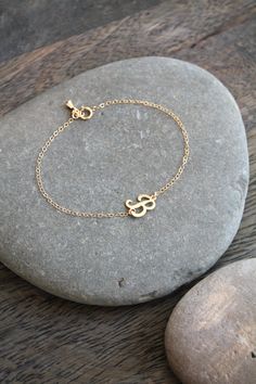 A dainty 14k gold filled bracelet with a script-letter initial, attached sideways on a shimmering chain, with a little teardrop charm by the clasp. Please select initial and size from the drop down menus. Available in the following letters only: A B C D E F H J K L M N P R S Y Components: Script letters - 14k gold filled, aprox 10x8mm each Chain - 14k gold filled Your item will arrive in a beautifully embossed Jewelry box - Ready for gift giving! Personalized Initials Bracelet Jewelry, Custom Name Adjustable 14k Gold Jewelry, Adjustable Everyday Jewelry With Initials, Everyday Adjustable Jewelry With Initials, Adjustable Hypoallergenic Initial Pendant Jewelry, Delicate Adjustable Jewelry For Personalized Gifts, Dainty Adjustable Jewelry For Personalized Gift, Adjustable Dainty Jewelry For Personalized Gift, Dainty Adjustable Initial Pendant Jewelry