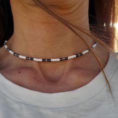 This is a 14 inch necklace using Czech 8/0 Opaque Grey Luster, Iris Sphinx and Opaque white ceylon seed beads. It is finished off with a silver plated lobster clasp and jump rings.  If you have a preference for a different length, just ask. I can always create one just for you. This necklace looks great on its own or layered with other necklaces. Also great for everyday wear. To maintain quality of necklace, keep dry(do not wear while swimming, showering, etc.) and avoid contact with moisture, p Handmade White Heishi Beads Choker, White Tiny Beads Choker, White Heishi Beads Necklace With Spacer Beads, White Tiny Beaded Necklaces For Jewelry Making, White Round Heishi Beads Jewelry, White Choker With Tiny Round Beads, White Minimalist Beaded Necklace With Tiny Beads, White Tiny Beaded Choker, White Choker With Round Beaded Chain