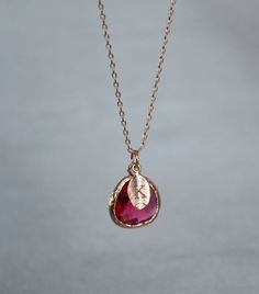 "This beautiful ruby necklace would be a perfect gift for a wedding, birthday, anniversary, graduation or for any occasion. Please click here to view the matching earrings: https://www.etsy.com/listing/751674821/ruby-earrings-july-birthstone-gift-july?ga_search_query=ruby&ref=shop_items_search_3&pro=1&frs=1 The rose gold, gold or silver plated ruby pendant is made of glass and is a gorgeous red shade that has dark pink hues in certain light. It measures approximately 12.5x 16 mm and Elegant Birthstone Necklace For Birthday And Valentine's Day, Elegant Birthday Birthstone Necklace For Valentine's Day, Rose Gold Ruby Jewelry For Parties, Elegant Valentine's Day Birthday Birthstone Necklace, Rose Gold Birthstone Jewelry For Birthday, Red Birthstone Necklace For Weddings, Red Birthstone Necklace For Birthday Gift, Rose Gold Ruby Necklace For Gift, Sterling Silver Birthstone Necklaces For Parties