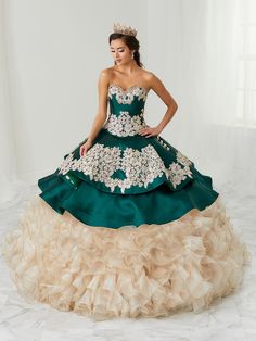 All eyes will be on you in this strapless charro ball gown with A-line ruffled skirt by House of Wu LA Glitter 24082. Make a bold statement in this gorgeous sweetheart neckline three-piece ball gown. The bodice is accented with corset boning, beaded appliques and the neckline is trimmed with beaded lace. Note: Matching bolero jacket Style #24082J is sold separately for $100 USD. House of Wu LA Glitter Designers Collection: Fall 2021 Style Number: 24082 Fabric: Mikado/Organza/Tulle Colors: Champa Glitter Quinceanera Dresses, Glitter Dresses, Quinceanera Collection, Charro Quinceanera Dresses, Quinceañera Ideas, Quinceñera Dresses, Debutante Ball, Quince Dress, Quinceanera Dress