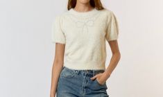 Color: Cream Description: Fuzzy sweater top with Pearl trim bow detail. Sweater With Pearls, Fuzzy Shorts, Pearl Sweater, Plus Jumpsuit, Short Sweater, Bow Sweater, Pearl Bow, Summer Clearance, Fuzzy Sweater