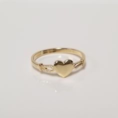 "Thanks for shopping our vintage estate store. We tend to sell well below wholesale and truly hope you enjoy all of our items. Many of the items are one of a kind, so please enjoy scrolling through the pictures and hopefully something will catch your eye. Brown spots are from camera or reflections. Estate 14k yellow gold heart baby ring. Custom made ring for our shop.  Ring size: 3 or 3.25 please select size Setting: 5mm 1/4\" Band width: 1.5mm Weight: .82 gram Marked 14k and it's sweet. One tha Classic Gold Heart Ring With Heart Charm, Vintage Gold Heart Ring With Birthstone, Classic Gold Heart Ring With Charm, Classic 14k Stamped Heart Ring As Gift, 14k Yellow Gold Engraved Ring For Valentine's Day, Valentine's Day 14k Yellow Gold Engraved Ring, Gold Heirloom Heart Ring For Valentine's Day, Heirloom Yellow Gold Heart Ring For Valentine's Day, Heirloom Yellow Gold Heart Ring Hallmarked