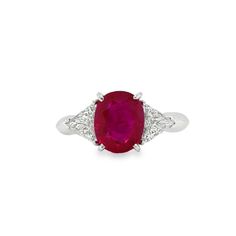 an oval ruby and diamond ring