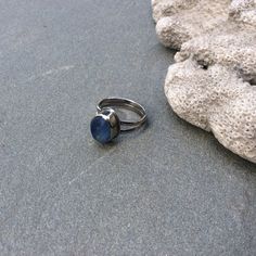 Here is a stunning piece of multi colored blue swirly sea glass from Seaham beach in England that I bezel set in fine silver to be the focal point of a double band of sterling silver. I then oxidized and polished it to bring out the beauty of the silver. It measures a US size 7.5. Own a piece of the ocean with this one of a kind ring. It will come in a little ribbon tied gift box perfect for that special someone. Thanks for looking :) Adjustable Silver Ring With Sea Glass, Adjustable Sea Glass Ring Jewelry, Handmade Sea Glass Ring Jewelry, Handmade Adjustable Sea Glass Rings, Blue Cabochon Moonstone Jewelry, Blue Rings With Large Stone For Healing, Unique Blue Cabochon Moonstone Ring, Unique Blue Moonstone Cabochon Ring, Unique Blue Moonstone Ring