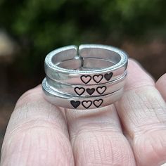 Each of these rings is adjustable and made of sturdy aluminum, which is lightweight but strong. They're also perfect for stacking! This listing comes with three rings. ♥ ♥ ♥ ♥ ♥ ♥ ♥ ♥ ♥ ♥ ♥ ♥ ♥ ♥ ♥ ♥ ♥ ♥ ♥ ♥ ♥ ♥ These inspirational rings are engraved with love and polished to a beautiful shine.  They're adjustable and made of sturdy aluminum, which is lightweight but because these are thicker bands, they're very strong. They're also perfect for stacking! Pick your perfect mantra for a daily remi Silver Adjustable Heart Ring For Gift, Adjustable Silver Heart Ring For Gift, Silver Adjustable Heart Ring As Gift, Adjustable Heart-shaped Stackable Rings For Valentine's Day, Adjustable Stackable Heart Rings For Valentine's Day, Adjustable Silver Heart-shaped Rings, Adjustable Silver Heart Shaped Rings, Adjustable Nickel-free Heart Promise Ring, Adjustable Heart-shaped Stackable Promise Rings