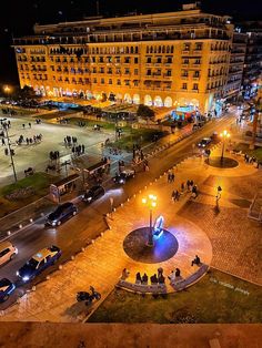 an aerial view of a city square at night