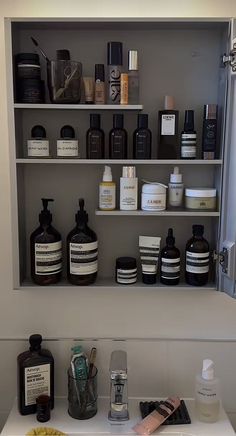 the shelves in the bathroom are filled with different types of skin care products