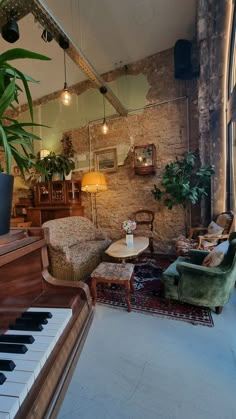 a living room filled with furniture next to a piano and potted plant on top of a table