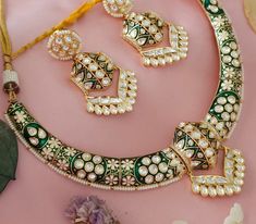 This is a Intrucate kundan hasli necklace.the meenakari is so detailed. Beautiful high end designer hasli necklace can be paired with your favorite outfit. Such a contemporary style can be pulled off with Indian as well as western wear.   Necklace Size - hasli  Earrings - kundan earrings Luxury Spiritual Meenakari Necklace, Eid Designer Meenakari Jewelry, Eid Meenakari Designer Jewelry, Designer Kundan Necklace With Zari For Festivals, Designer Green Kundan Necklace With Cutdana, Green Kundan Necklace With Cutdana For Designer Wear, Bollywood Designer Jewelry For Navratri, Traditional Necklaces For Diwali Designer Wear, Diwali Designer Tilla Necklace