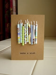 a card with four different colored toothbrushes on it that says make a wish