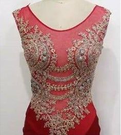 The gold embroidery contrasting on this red evening dress really adds to the overall design.