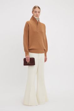 A versatile neckline with multiple styling options imbues the Shawl Neck Jumper with a distinct personality. Made from a mid-weight lambswool knit and featuring an intricate rib stitch, it has an oversized fit for casual sophistication. A gold-tone metal B logo trim at the left front adds a discrete point of difference. Victoria Beckham Shawl Neck Knitted Jumper In Camel  - Size L UK Chic Wool Sweater With Ribbed Collar, Designer Brown Wool Sweater, Designer Brown Sweater For Fall, Elegant Beige Sweater With Ribbed Collar, Elegant Brown Sweater With Ribbed Collar, Elegant Brown Merino Wool Sweater, Camel Sweater For Workwear In Fall, Elegant Brown Sweater For Workwear, Elegant Brown Sweater For Work