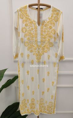 DESCRIPTION ▪ Fabric: Modal ▪ Sleeves: 3/4 Sleeves ▪ Style: Straight Kurti ▪ Length: 44-46 Inches ▪ Occasions: Casual Wear, Office Wear, Festive Wear ▪ Garment Care: Hand Wash Only ▪ Net Content: Only Kurti Traditional Half Sleeve Summer Kurta, Fitted White Long Salwar Kameez, Traditional White Kurta For Summer, Traditional White Summer Kurta, White Fitted Kurta For Diwali, Traditional Off White Dresses With Dabka Work, White Cutdana Dress For Summer, Fitted Long Sleeve Kaftan For Festivals, Traditional Fitted Kurta With 3/4 Sleeves