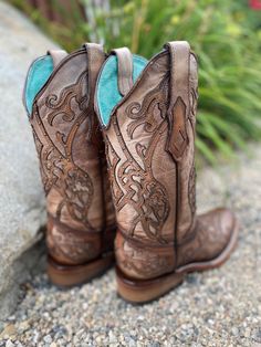 This Corral Women's Western Boot in rich Brown leaves us speechless. Its stunning good looks include a trendy square toe. This boot is everything a cowgirl could want for that special boot in her collection. Brown leather Brown overlay Embellished with brass studs Leather lining Leather outsole Double stitch welt Goodyear welt construction Walking heel Square toe 1.5" heel 12" Shaft 15.5" Calf Circumference ﻿Measurements for this boot were taken from a size 6M. Please note that measurements may Western Style Square Toe Boots For Western-themed Events, Rustic Square Toe Boots For Rodeo, Western Style Brown Heeled Boots, Rustic Square Toe Ranch Boots, Western Wide Calf Heeled Boots With Square Toe, Fitted Hand Tooled Boots For Rodeo, Hand Tooled Fitted Boots For Rodeo, Western Style Square Toe Heeled Boots, Western Heeled Boots With Square Toe