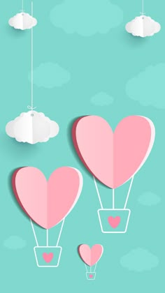 two hot air balloons floating in the sky with hearts attached to them, and some clouds above