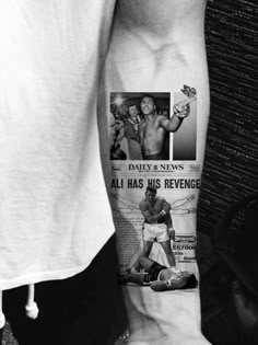 a black and white photo of a man's arm with an ad for the daily news