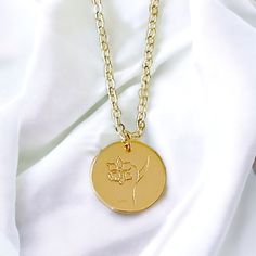 This Birth Month Flower Pendant Necklace is the ideal gift to celebrate a special birth month. With its elegant flower design, it is a thoughtful way to show your loved ones how much you care. Consider giving this unique piece of jewelry as a token of your affection. Material: 14K gold filled and plated Chain: 14K gold filled 16.5” Rolo chain Pendant: 14K gold plated hand stamped flower Lead and nickel free Delivered in a soft protective jewelry pouch and gift box Crafted in the USA Ships from M Gold Hypoallergenic Necklace With Flower Pendant, Hypoallergenic Gold Necklace With Flower Pendant, Gold Hypoallergenic Flower Pendant Necklace, Spiritual Yellow Gold Birth Flower Jewelry, Spiritual Yellow Gold Jewelry With Birth Flower, Delicate Yellow Gold Birth Flower Jewelry, 14k Gold Filled Birth Flower Pendant Jewelry, 14k Gold Birth Flower Pendant Jewelry, Cadmium-free Necklace For Mother's Day Gift