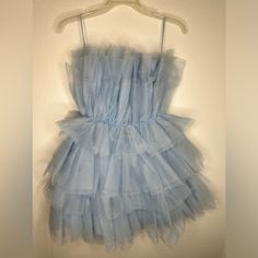 Light Blue Tulle Dress. Light Blue Puffy Dress, Light Blue Ruffled Evening Dress, Blue Tulle Dress For Summer, Elegant Light Blue Mini Dress For Casual Occasions, Blue Mini Tulle Dresses, Blue Tulle Mini Dress For Spring, Blue Ruffle Dresses For Party, Blue Mini Dress For Prom In Summer, Chic Blue Prom Dress