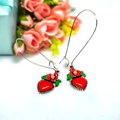 Red enamel heart earrings with long silver earwires. Mexican earrings. Mexican jewelry. Handmade Heart-shaped Enamel Earrings, Red Hand Painted Earrings For Gift, Enamel Heart Charm Earrings As Gift, Enamel Earrings With Heart Charm As Gift, Handmade Red Earrings For Mother's Day, Hand-painted Red Jewelry For Valentine's Day, Hand Painted Heart Earrings For Valentine's Day Gift, Hand Painted Red Jewelry For Valentine's Day, Valentine's Day Enamel Dangle Earrings