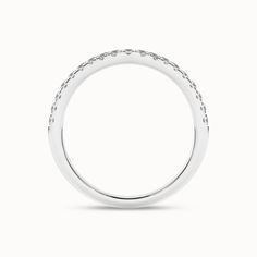 The Rippling Round Ring stands as a celebration of promises made. Captivatingly reimagining tradition, this ring showcases 19 delicate diamonds nestled in a micro pave setting. Its weightless design adds to its comfort and modern appeal. Versatile and meaningful, this chic ring makes for a staple stackable accessory. Diamond Stackable Rings With Pave Setting For Promise, Formal Stackable Rings With Pave Setting, Wedding Stackable Diamond Rings With Pave Setting, Wedding Rings With Pave Setting, Wedding Diamond Ring With Pave Setting, Diamond Stackable Rings With Pave Setting For Wedding, Stackable Diamond Rings With Pave Setting, Formal Diamond Stackable Rings With Pave Setting, Refined Single Cut Diamond Promise Ring