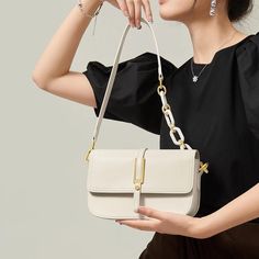 Discover Elegance and Versatility Step into the season with sophistication using our exclusive White Leather Crossbody & Shoulder Bag. Designed for the fashion-forward woman, this bag embodies elegance and versatility, perfectly complementing your spring and summer wardrobe. Whether you're attending a daytime event or an evening soiree, this bag seamlessly adapts to all occasions, ensuring you always step out in style. Premium Quality and Design Crafted with genuine cow leather, this bag boasts a soft, luxurious texture that's both durable and stylish. The saddle shape design, combined with a solid pattern and a flap pocket exterior, offers a classic yet contemporary look. Its multiple interior compartments, including a slot pocket, zipper pocket, and a spacious main compartment, provide a Elegant Shoulder Bag With Detachable Handle For Travel, Elegant Clutch Shoulder Bag For Travel, Elegant Shoulder Bag With Removable Pouch For Daily Use, Elegant Canvas Shoulder Bag For Travel, Spring Formal Leather Shoulder Bag, Elegant Crochet Shoulder Bag For Travel, Elegant Satchel Shoulder Bag For Travel, Elegant Shoulder Bag With Removable Pouch, Handheld Bags With Chain Strap