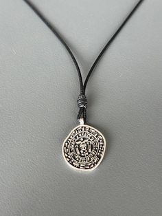 The Hittite royal seal was a privileged item belonging to kings, queens, and sometimes princes, representing the power and strength of its owner. The symbols formed in the hieroglyphs and cuneiform writings on the seal represent health and long life. All our artisan crafted products are made from 925 sterling silver which requires polishing from time to time from oxidation. You can quickly restore silver to shine with a polishing cloth Please; Avoid contact with cosmetics and chemicals. Don't wear it in the shower, pool, spa, or the beach. Stamp Necklace, Amulet Charm, Stamped Necklaces, Artisan Craft, Locket Necklace, Long Life, Locket, Charm Pendant, Silver Necklace