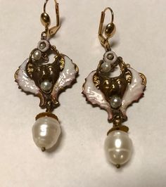 "A vintage pair of white enamel and  genuine baroque pearl drop pierced OWL earrings.  This were created years ago and saved from the fire that destroyed almost all of my previous jewelry.  They are one of my favorite earring designs from the past.  Signed on the back.  Length-21/2\".  unique design." Victorian Teardrop Pearl Drop Earrings, Ornate White Dangle Jewelry, Unique White Enamel Earrings, Vintage Pierced Enamel Earrings, Vintage Pearl Drop Jewelry Gift, Victorian Style Drop Pearl Earrings, Vintage Pearl Drop Jewelry For Gift, Ornate White Dangle Earrings, Ornate White Pierced Earrings