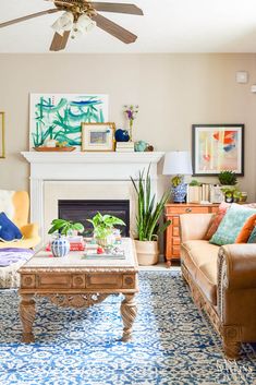 a living room filled with furniture and a fire place