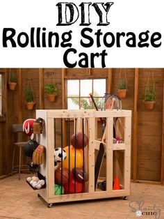 the diy rolling storage cart is made out of pallet wood and holds various sports equipment