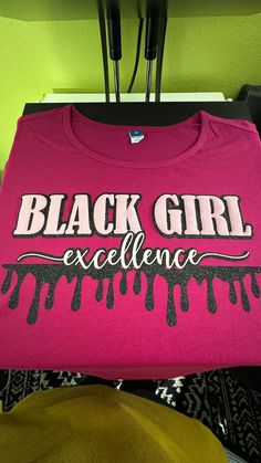 You are a personification of excellence! We are not moving with magic this season but in excellence. This t-shirt isn't the traditional plain vinyl! Black Girl is puff vinyl and trimmed with glitter vinyl. Oh, don't forget we drip with glitter too! Oh, to be black and move in excellence! This isn't your usual t-shirt...drip with glitter and puff this season. Black Cotton T-shirt With Glitter Print, Black Short Sleeve T-shirt With Glitter Print, Black T-shirt With Glitter Print And Short Sleeves, Trendy Black T-shirt With Glitter Print, Black Glitter Print Graphic Tee, Black Graphic Tee With Glitter Print, Black Crew Neck T-shirt With Glitter Print, Puff Vinyl, Glitter Vinyl